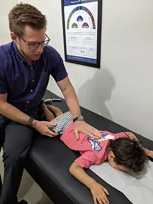 Chiropractor Wall Township NJ Anthony Pellegrino Adjusting Child